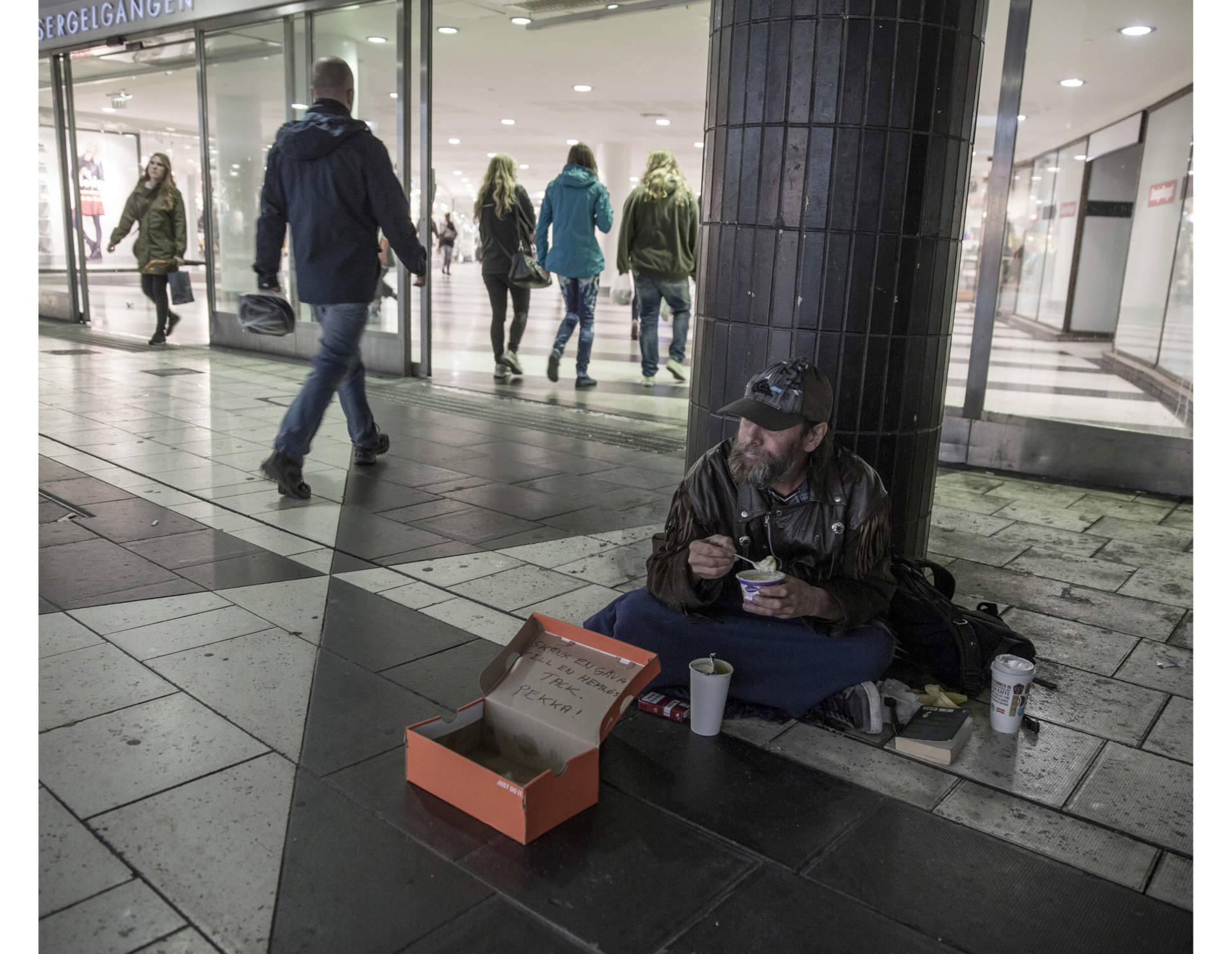 Pekka begs for money at his favourite spot in central Stockholm. The money he gets, he spends on Cigarettes and beer.